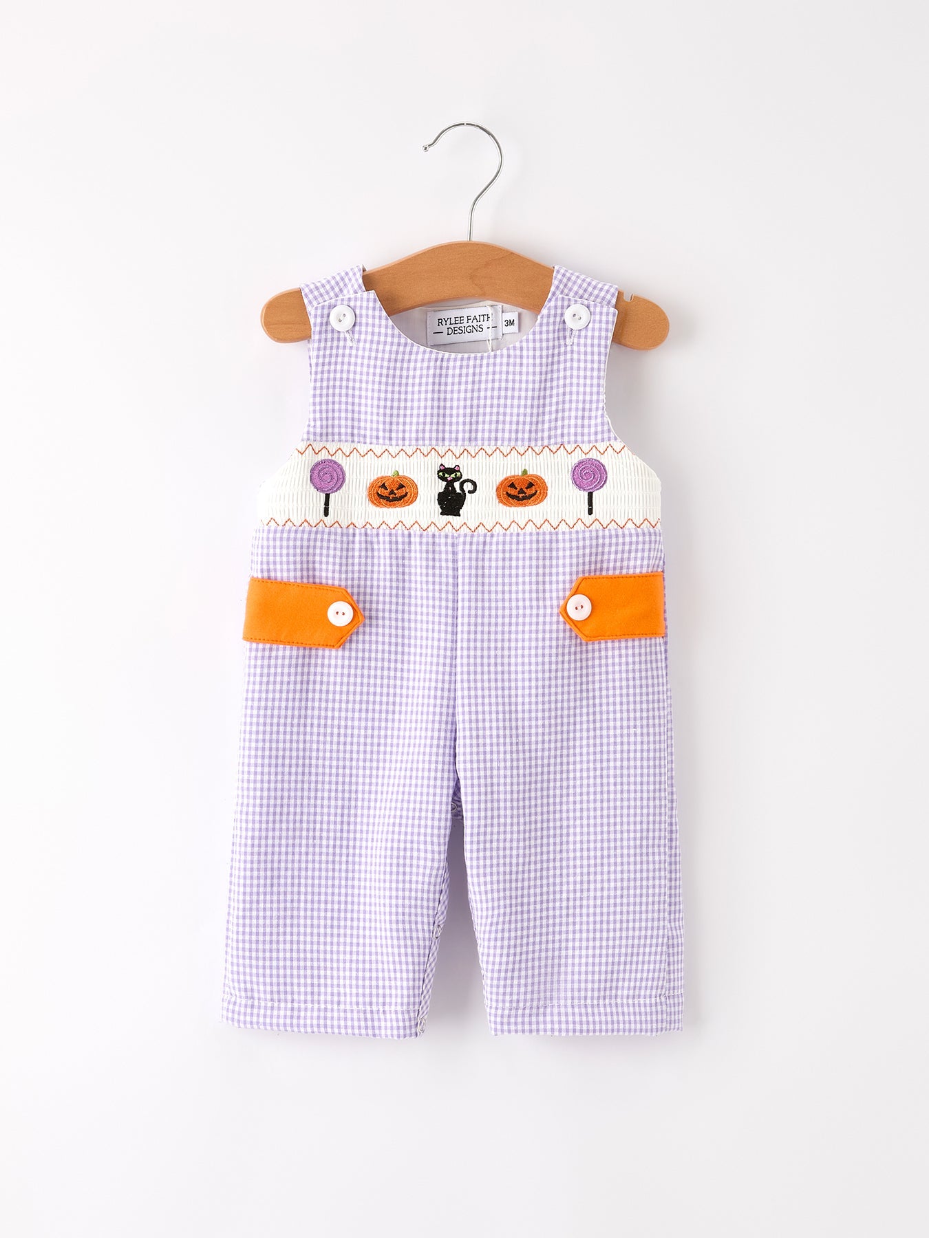 Baby overalls with Halloween design on a white background