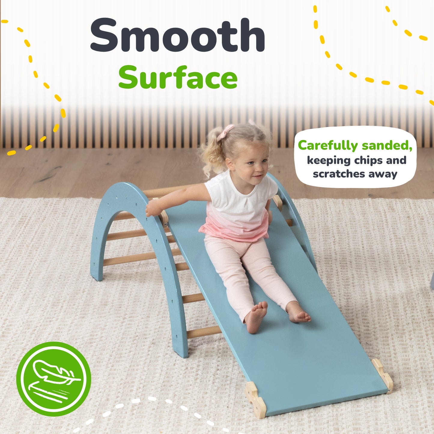 Child sliding down a blue slide with text about a smooth surface