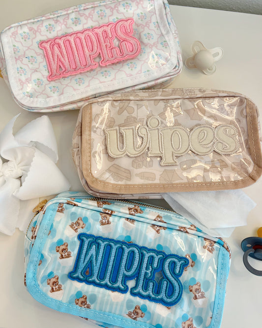 Three pouches labeled 'wipes' with different designs on a light background