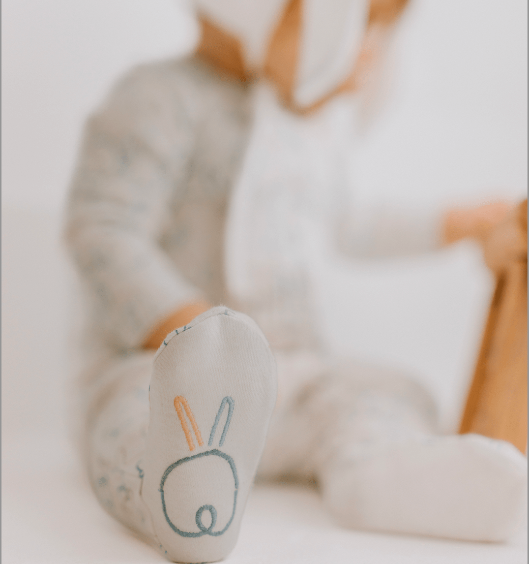 Children's socks with bunny design on a blurred background