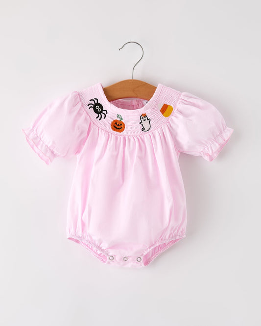 Pink baby romper with Halloween-themed embroidery on a white background