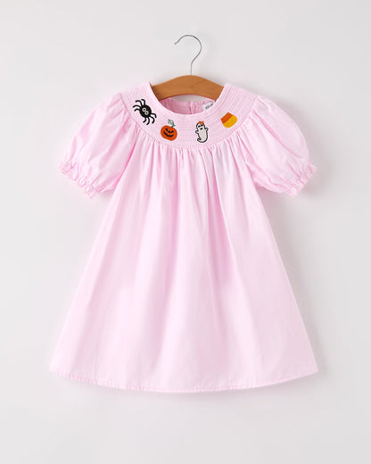 Pink dress with Halloween-themed embroidery on a white background