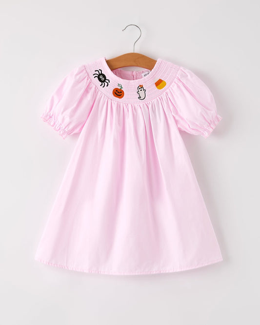 Pink dress with Halloween-themed embroidery on a white background