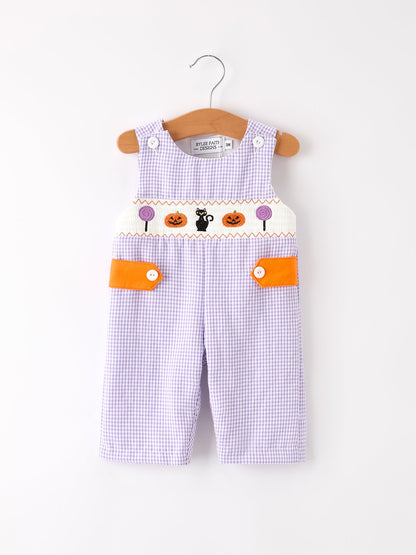 Baby overalls with Halloween design on a white background