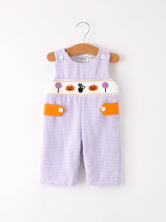 Baby overalls with Halloween design on a white background