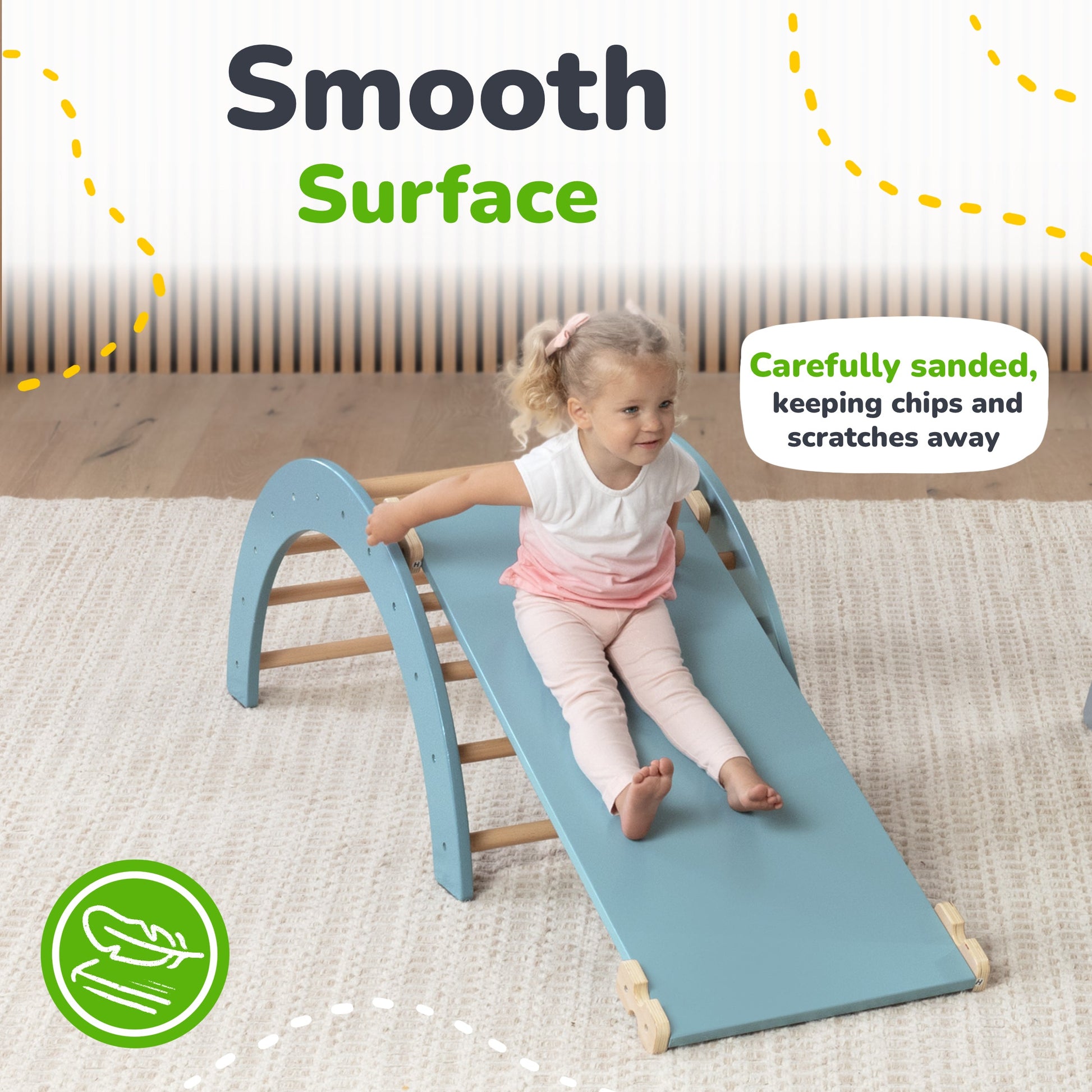 Child sliding down a blue slide with text about a smooth surface