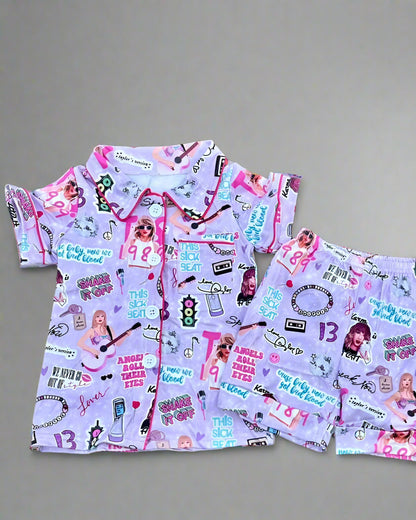 Children's pajama set with colorful design on a wooden surface
