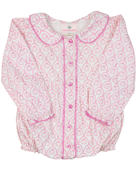 Baby romper with pink and white pumpkin pattern on a white background