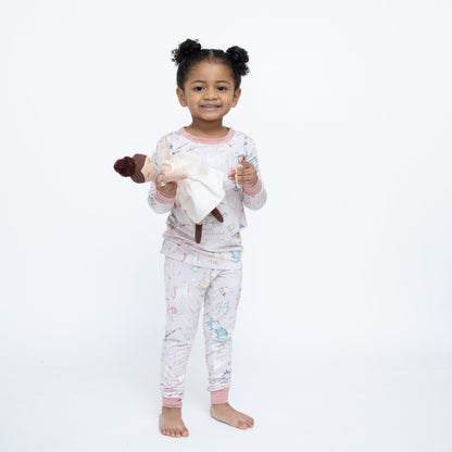 Child wearing pajamas with a white background
