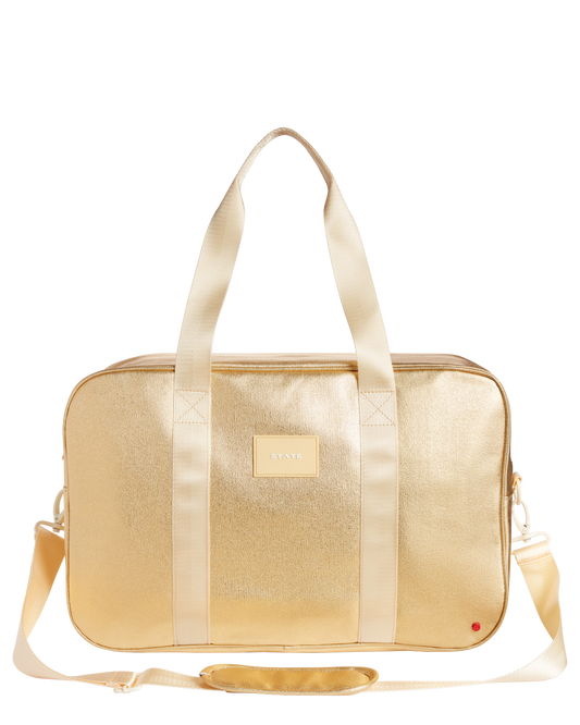 Gold duffel bag with a visible brand label on a white background