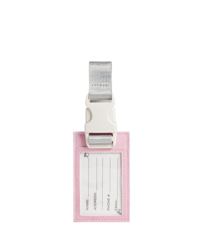 Pink luggage tag with white label and silver strap on a white background