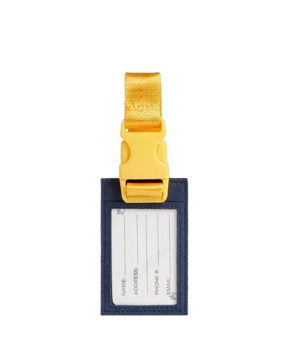Luggage tag with gold buckle on a white background