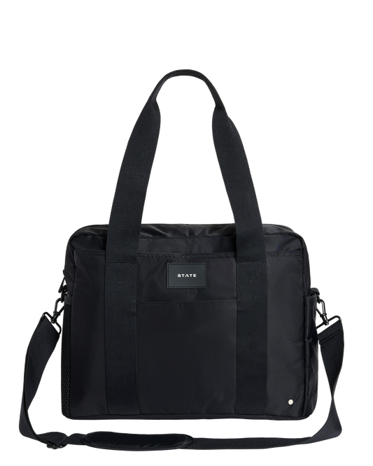 Black diaper bag with a visible brand label on a white background