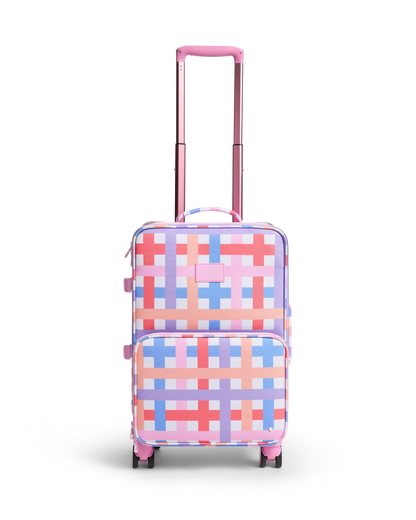 Checkered patterned suitcase with pink handle on a white background