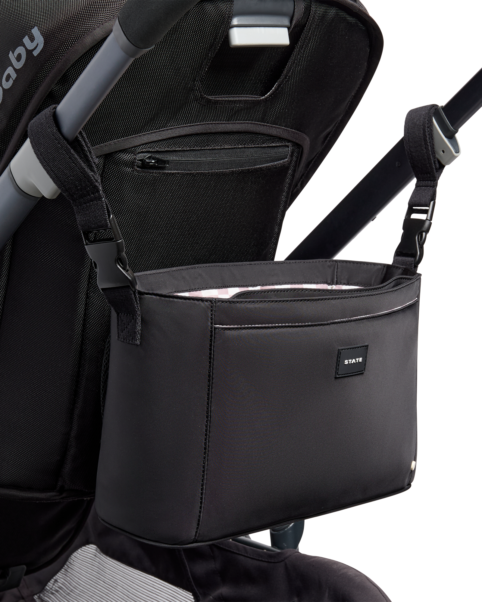 Black stroller organizer attached to a stroller on a white background