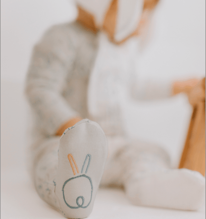 Children's socks with bunny design on a blurred background
