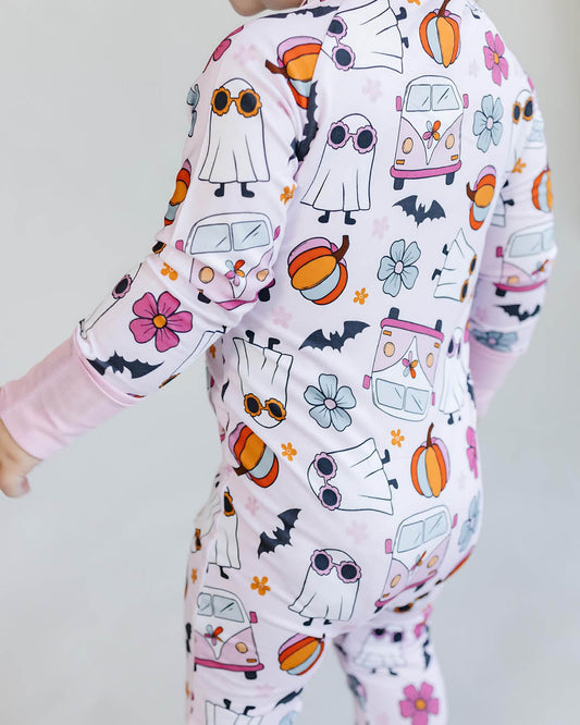 Children's onesie with Halloween-themed pattern on a plain background